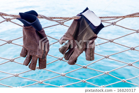 Sailing glove hanging on the nets. Sailing glove hanging on the nets. 16820317