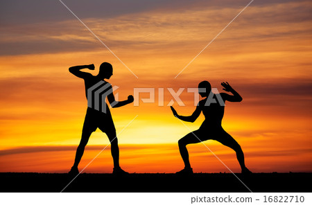 Silhouettes of two fighters  16822710