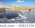 Hunters on the ice pond waiting victim.  16823156