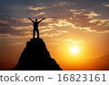 Silhouette of a man on a mountain top.  16823161