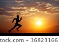 Silhouette of running man against the colorful sky 16823166