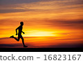 Silhouette of running man against the colorful sky 16823167