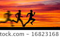 Silhouette of running man against the colorful sky 16823168