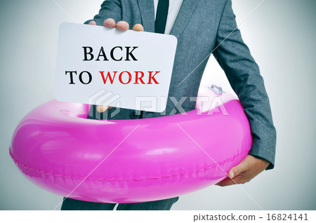 businessman with signboard with text back to work 16824141