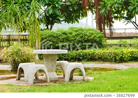 Stone Table Set in Landscaped Garden Stone Table Set in Landscaped Garden 16827699