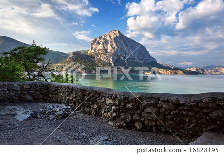 Beautiful summer sunset at the sea with mountains Beautiful summer sunset at the sea with mountains 16828195