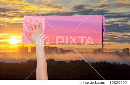 hand deletes yellow sunrise sky by pink cloth hand deletes yellow sunrise sky by pink cloth 16829803