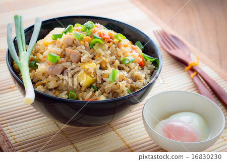 Fried Rice and soft-boiled egg on wooden table 16830230