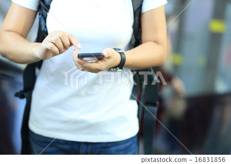 closeup of young woman use smart phone in city closeup of young woman use smart phone in city 16831856