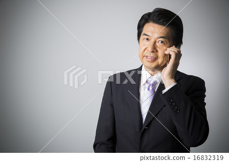 Business image Middle male talking with a smartphone Business image Middle male talking with a smartphone 16832319