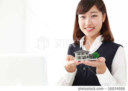 Business woman with housing Business woman with housing 16834086