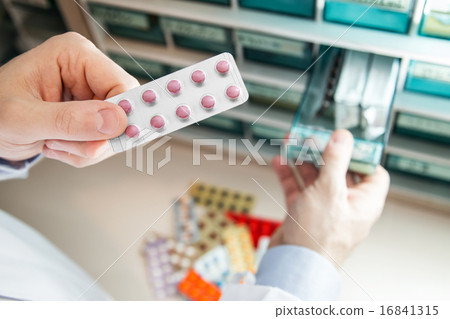 Pharmacist pharmacy hospital to take medicine out of medicine shelf Pharmacist pharmacy hospital to take medicine out of medicine shelf 16841315