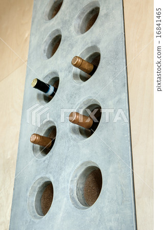 Several bottles of wine in a special concrete hole 16841465