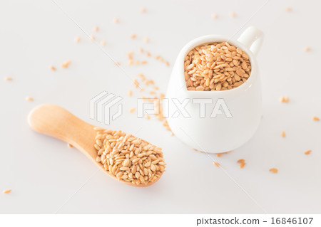 Yellow flax seed on clean kitchen table Yellow flax seed on clean kitchen table 16846107