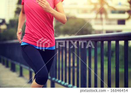 Runner athlete running on iron bridge.   16846454