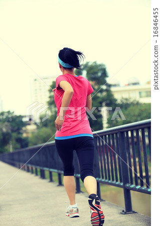 Runner athlete running on iron bridge.   16846455