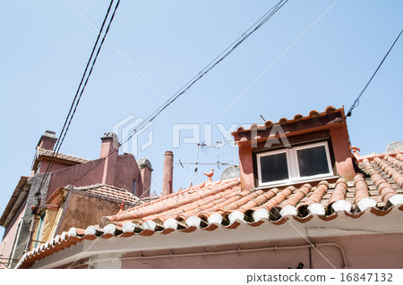 Townscape in suburbs of Lisbon Red-brown roof and electric wire with bay window 16847132