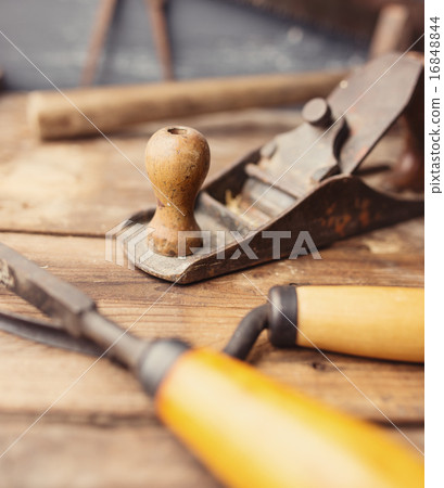 Od vintage hand tools on wooden background. 16848844