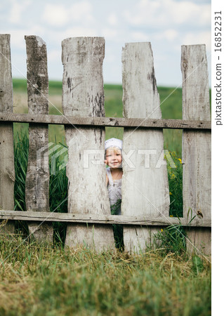 little girl and wooden fence little girl and wooden fence 16852231