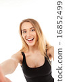 young pretty blonde women taking selfie 16852499