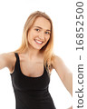 young pretty blonde women taking selfie 16852500