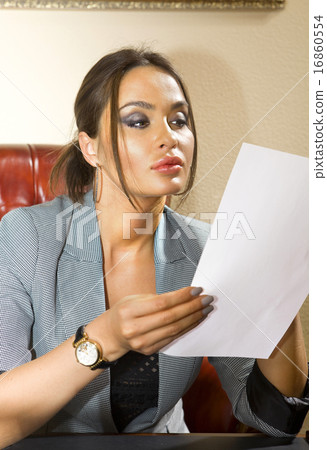 woman with sheet of paper 16860554