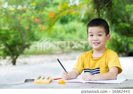 boy use pencil writing on notebook for writing book 16862443