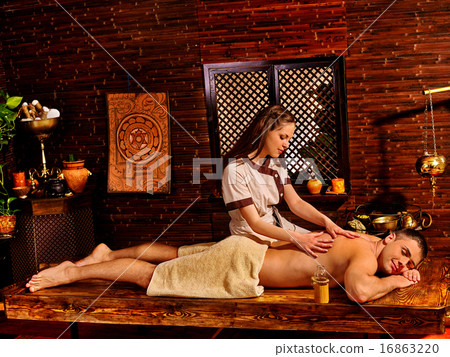 Man having Ayurvedic spa treatment. 16863220