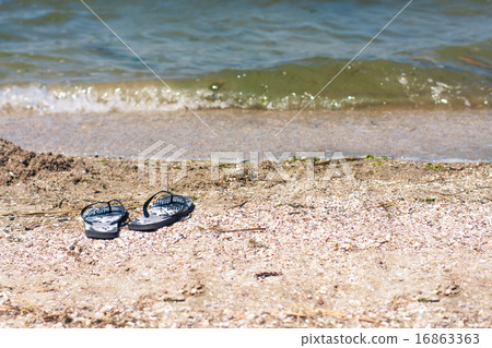 Black and Whiet Sandals on the beach 16863363