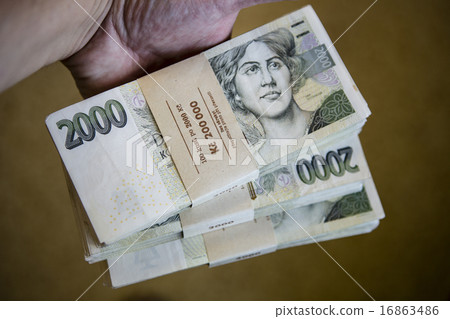 pack of money - big pile of banknotes in hand pack of money - big pile of banknotes in hand 16863486