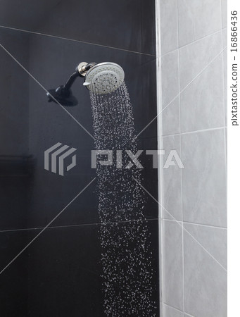 shower head with water drops flowing 16866436