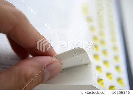 Hand flipping the bible with shallow DOF 16866546