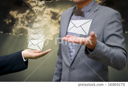 Businessman get email in hand with shiny sky 16869278