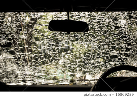 Damaged glass (car windshield) inside car 16869289