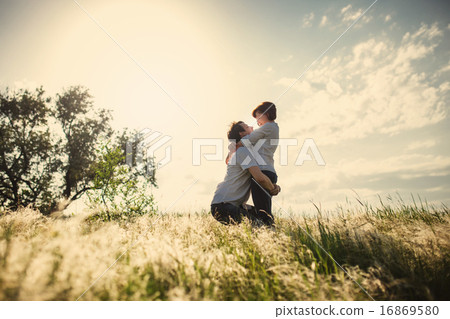 Happy couple outdoor, summertime, tinted photo Happy couple outdoor, summertime, tinted photo 16869580