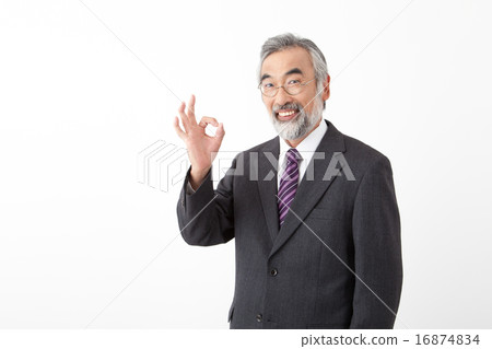 Senior businessman who issues an OK sign Senior businessman who issues an OK sign 16874834