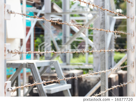 Barbed Wire Fence border the dangerous area 16877720