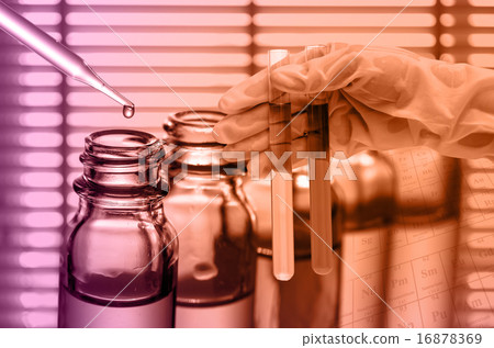 Chemical Laboratory,scientist dropping the reagent into test fla 16878369
