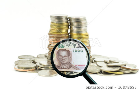 magnifying glass with background of coins to be dollar, business 16878653