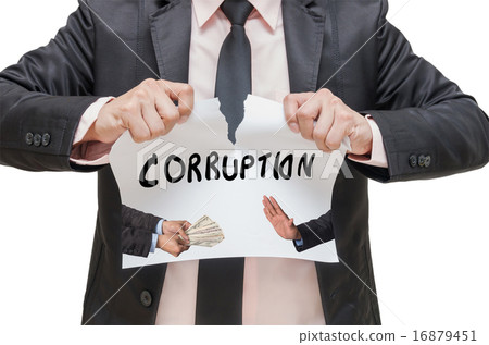 Businessman ripBusinessman ripping up the CORRUPTION sign with r 16879451