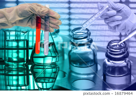 Chemical Laboratory,scientist dropping the reagent into test fla 16879464