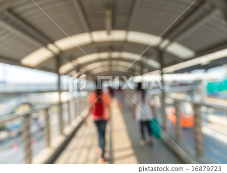 Abstract blurred photo of people with pathway skywalker 16879723
