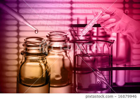 Chemical Laboratory,scientist dropping the reagent into test fla Chemical Laboratory,scientist dropping the reagent into test fla 16879946