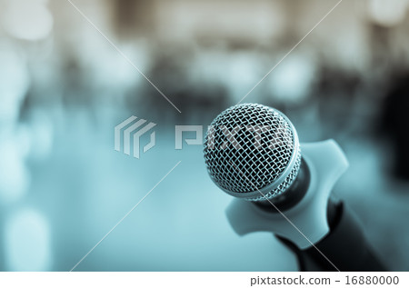 Close up of microphone in conference room on blurred background Close up of microphone in conference room on blurred background 16880000