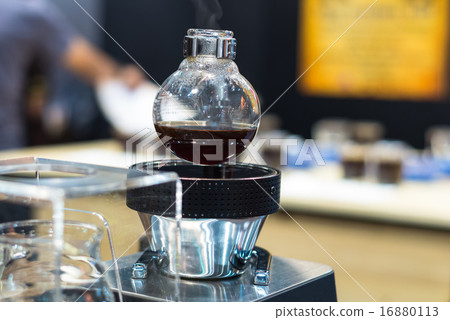 Coffee machine in shop with customer blurred background 16880113