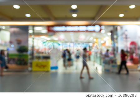Abstract blurred photo of store with people in department store 16880298