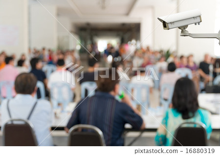CCTV security camera on monitor the Meeting Blurred background a CCTV security camera on monitor the Meeting Blurred background a 16880319