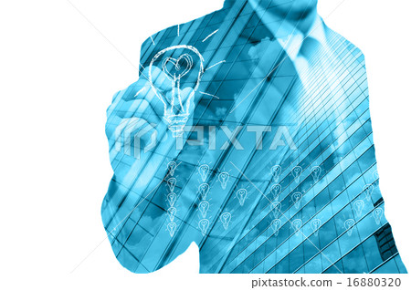 Double exposure of businessman writing the idea with cityscape b Double exposure of businessman writing the idea with cityscape b 16880320