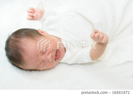 Newborn baby crying over white spirit 16881872