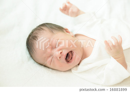 Newborn baby crying over white spirit 16881899
